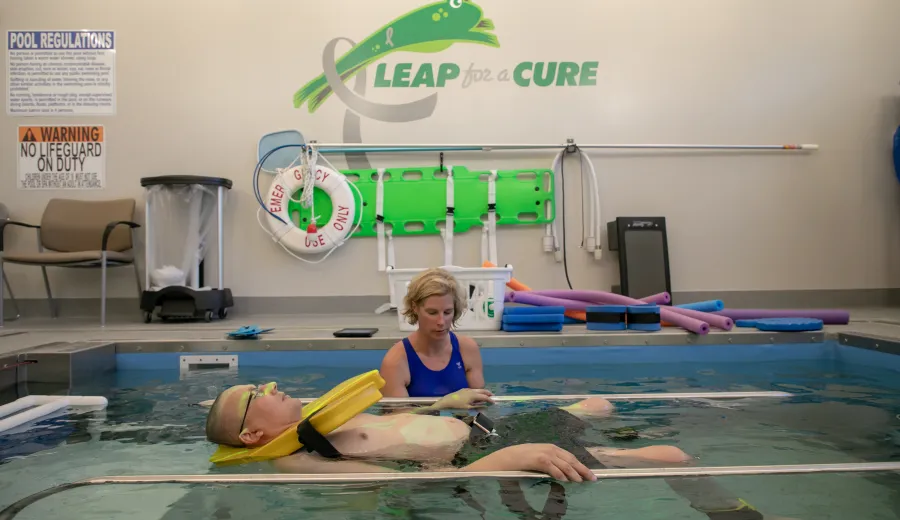 Mike Lambert works with Physical Therapist Julie Jessen, PT